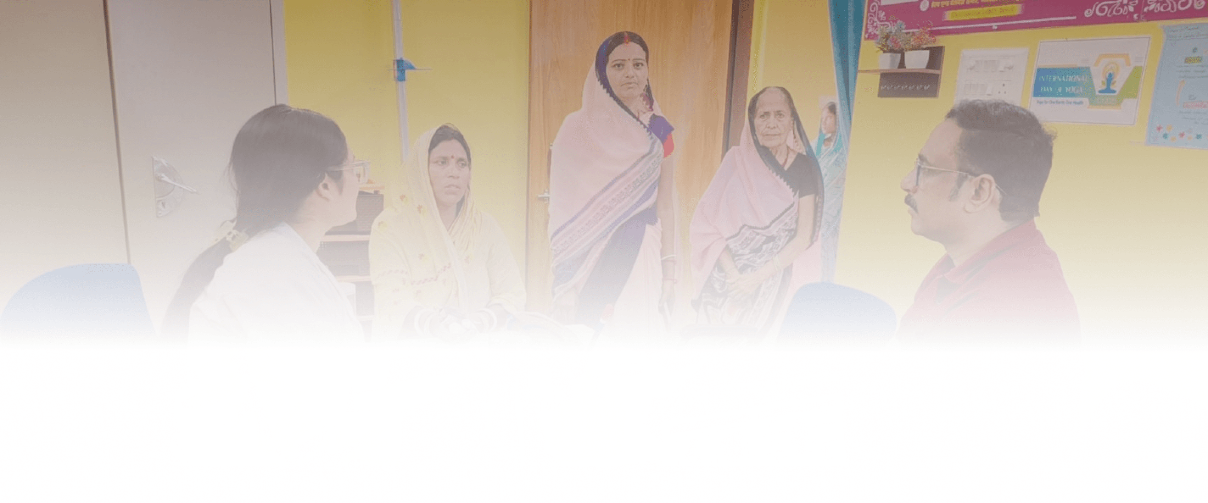 South Asian healthcare professionals in a meeting room conversing